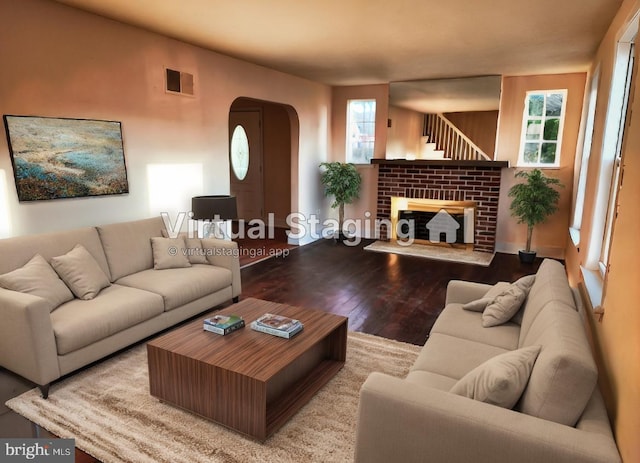 living room with a fireplace and hardwood / wood-style flooring