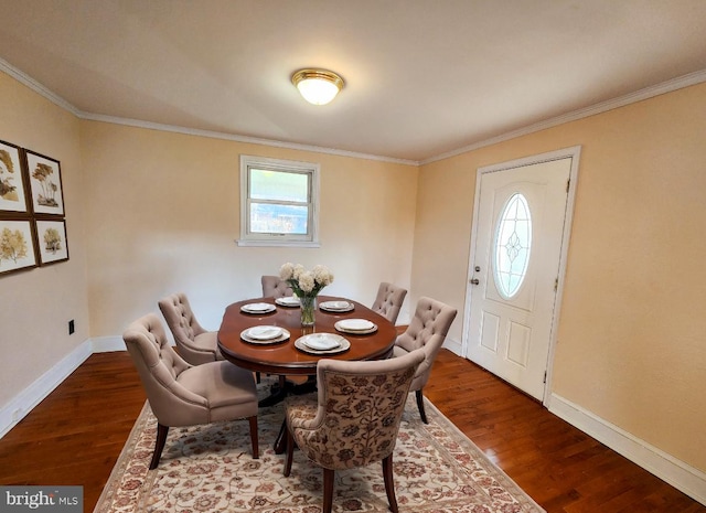 dining area featuring dark hardwood / wood-style floors and ornamental molding