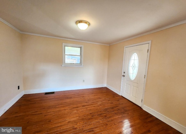 foyer entrance featuring dark hardwood / wood-style flooring and ornamental molding