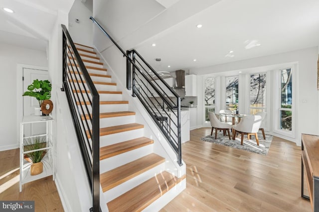 staircase featuring hardwood / wood-style flooring