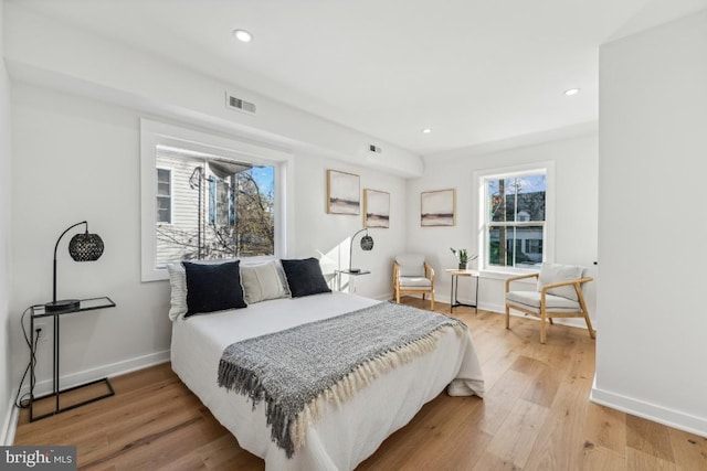 bedroom with hardwood / wood-style flooring