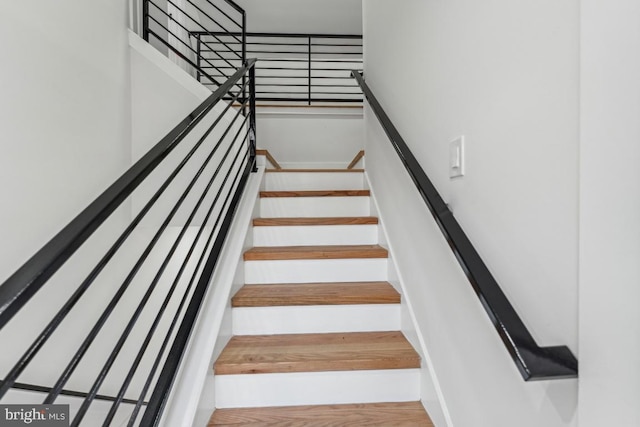 staircase featuring hardwood / wood-style floors