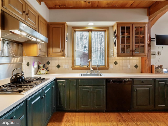 kitchen with stainless steel gas cooktop, dishwasher, sink, and light hardwood / wood-style flooring