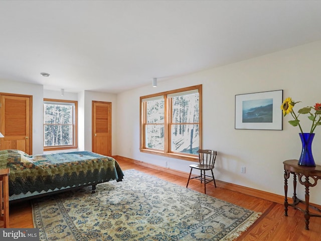 bedroom with hardwood / wood-style flooring