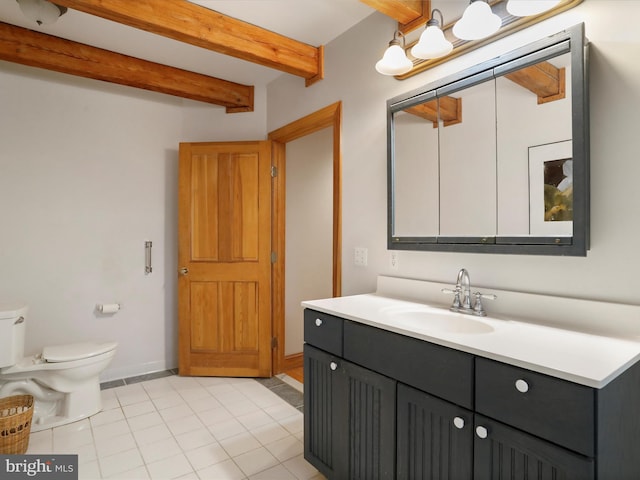 bathroom with vanity, beam ceiling, tile patterned floors, and toilet