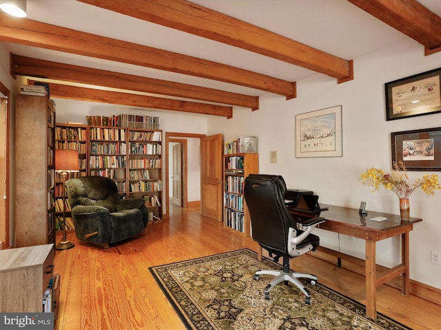 office with beam ceiling and hardwood / wood-style flooring