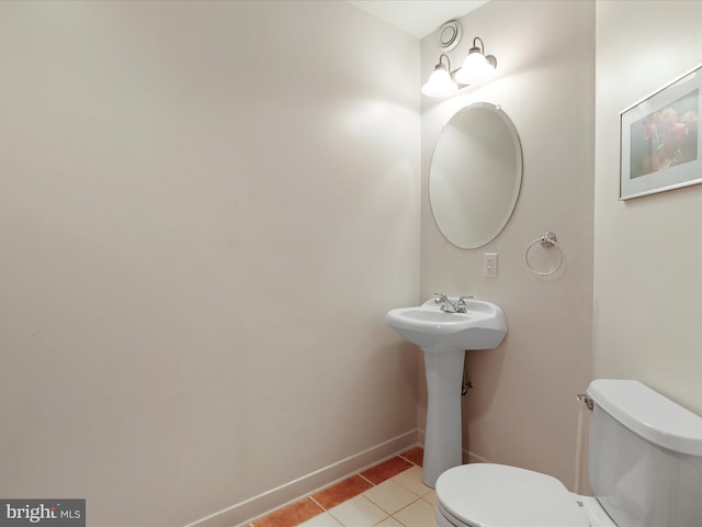 bathroom featuring tile patterned floors and toilet