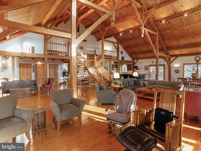 living room with wood ceiling and light hardwood / wood-style floors