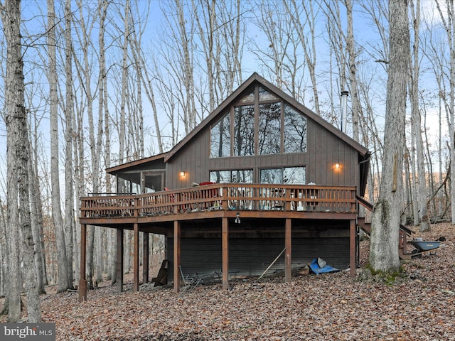 back of property featuring a deck