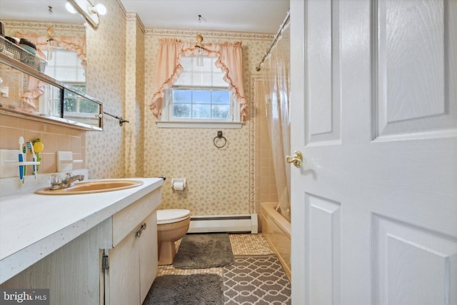 full bathroom with a wealth of natural light, vanity, shower / tub combo, and a baseboard heating unit