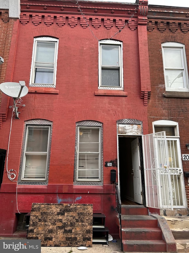 view of property with brick siding