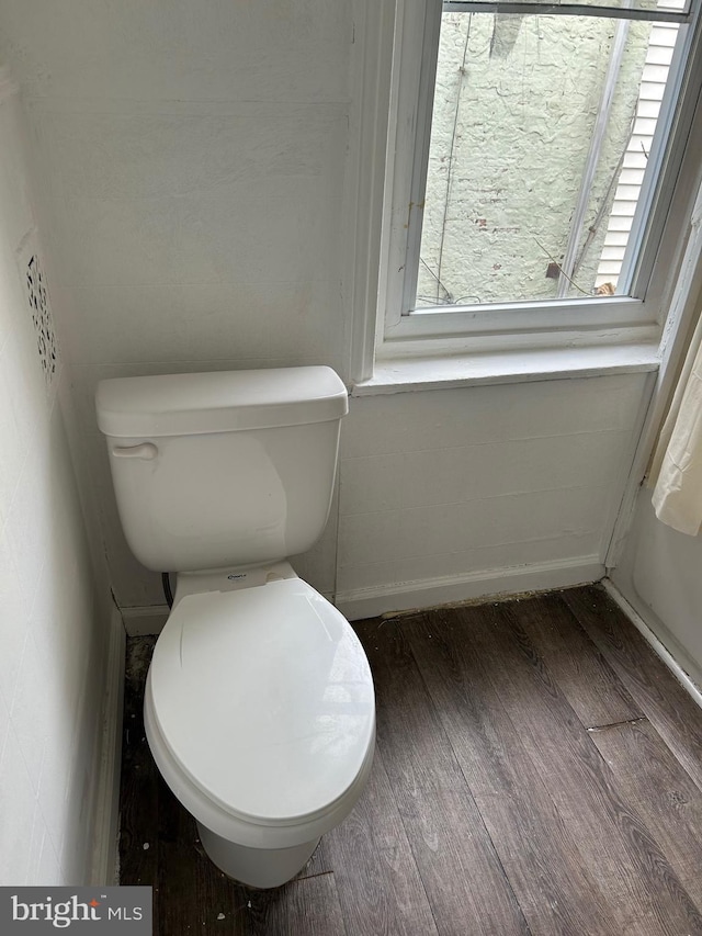 bathroom featuring hardwood / wood-style floors and toilet