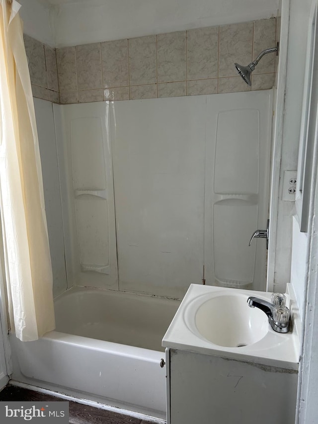 bathroom featuring vanity and shower / bath combination with curtain