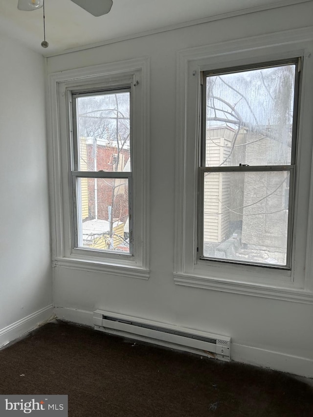 interior details featuring ceiling fan and a baseboard radiator