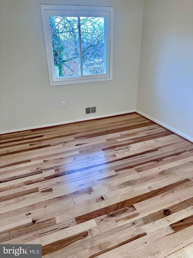 empty room featuring light hardwood / wood-style floors