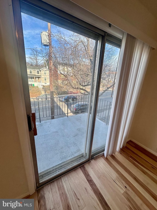 doorway featuring hardwood / wood-style floors