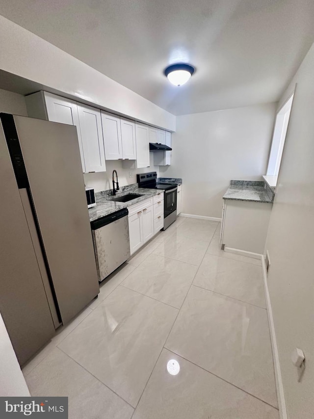 kitchen featuring appliances with stainless steel finishes, sink, and white cabinets