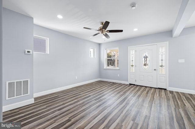 foyer with dark hardwood / wood-style floors and ceiling fan