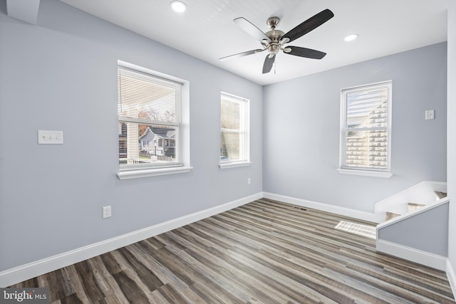 unfurnished room with hardwood / wood-style flooring and ceiling fan