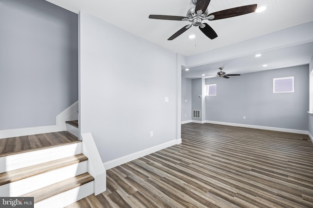 interior space with ceiling fan and dark wood-type flooring