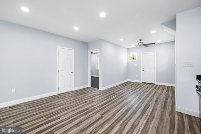 spare room featuring dark hardwood / wood-style floors and ceiling fan