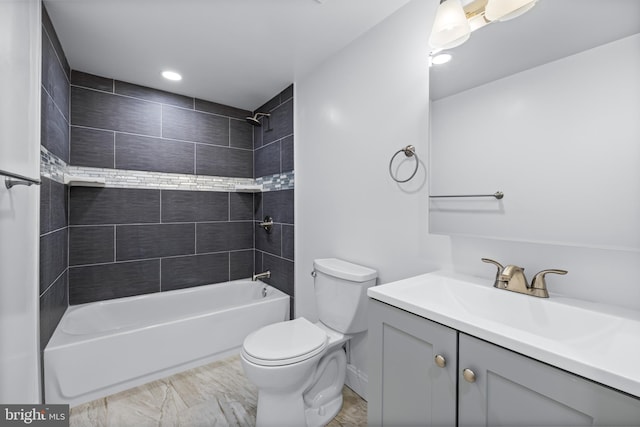 full bathroom with vanity, toilet, and tiled shower / bath