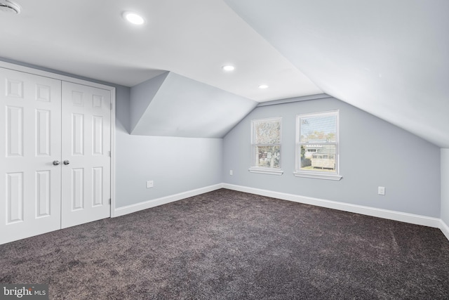 bonus room with carpet and lofted ceiling