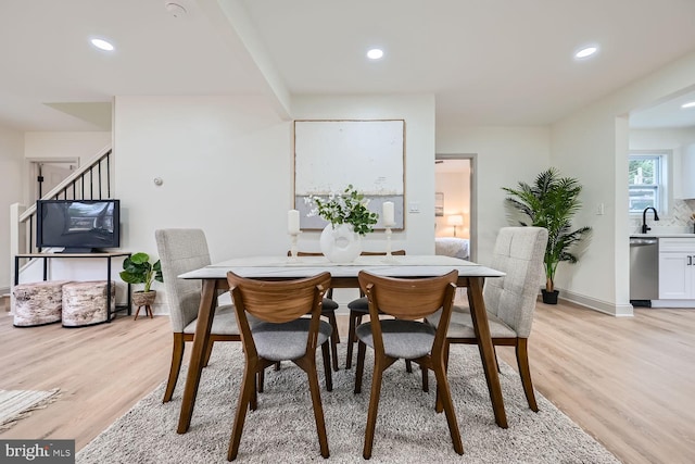 dining room with light wood-type flooring