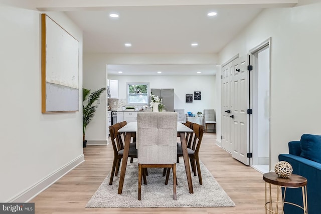 dining room with light hardwood / wood-style flooring