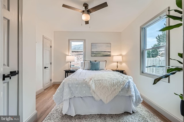 bedroom featuring light hardwood / wood-style floors and ceiling fan