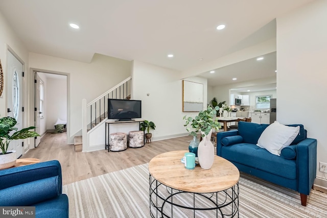 living room with light hardwood / wood-style flooring