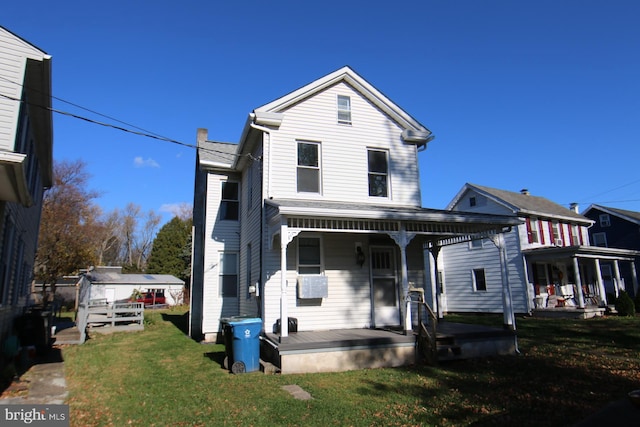 view of front property with a front lawn and a porch