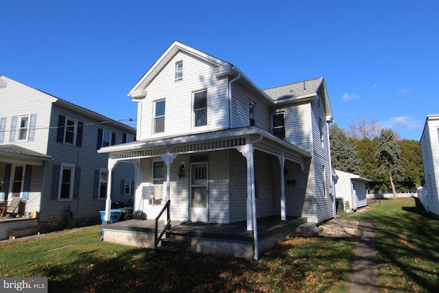 view of front of house featuring a porch and a front lawn