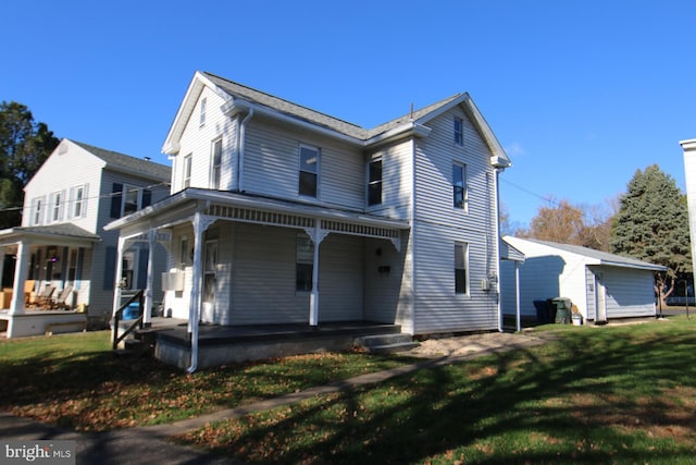 view of front facade with a porch and a front lawn