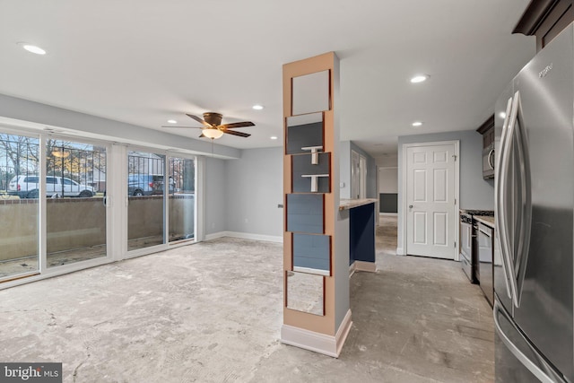 kitchen with ceiling fan, concrete flooring, and appliances with stainless steel finishes