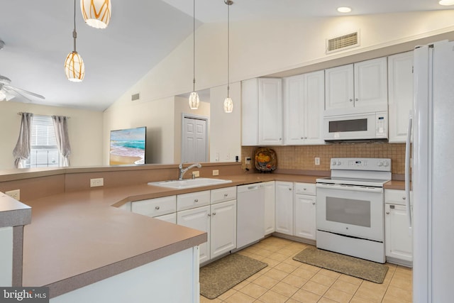 kitchen featuring white cabinets, kitchen peninsula, white appliances, and hanging light fixtures