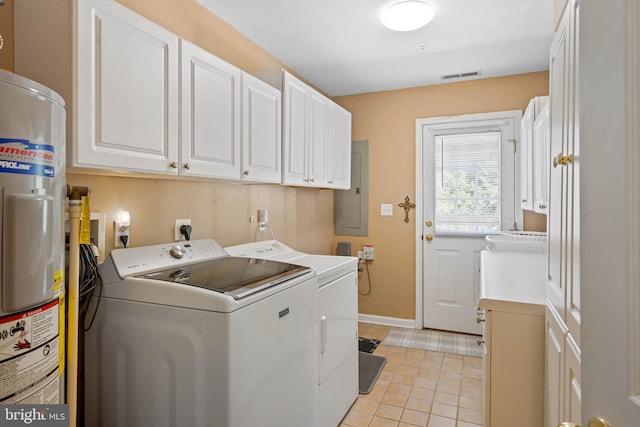 laundry area with cabinets, water heater, independent washer and dryer, electric panel, and light tile patterned floors