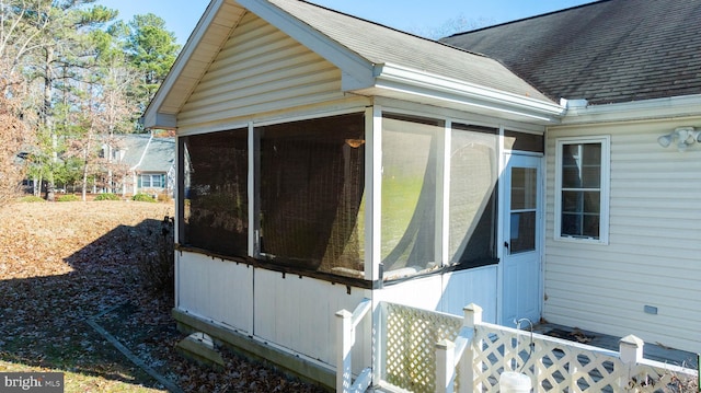 view of home's exterior featuring a sunroom