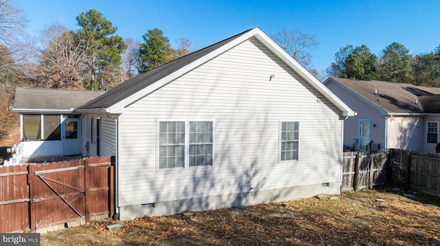 view of side of property with a sunroom