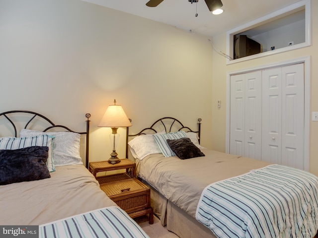 carpeted bedroom with a closet and ceiling fan