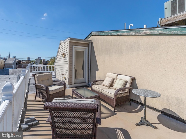 view of patio with an outdoor hangout area, a balcony, and cooling unit