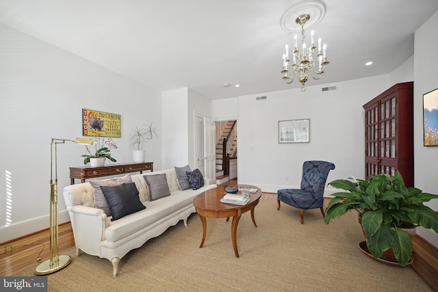 living room featuring a chandelier and hardwood / wood-style floors