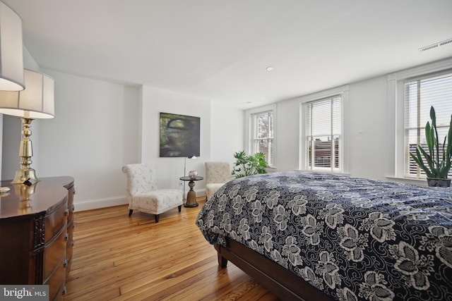 bedroom with hardwood / wood-style floors