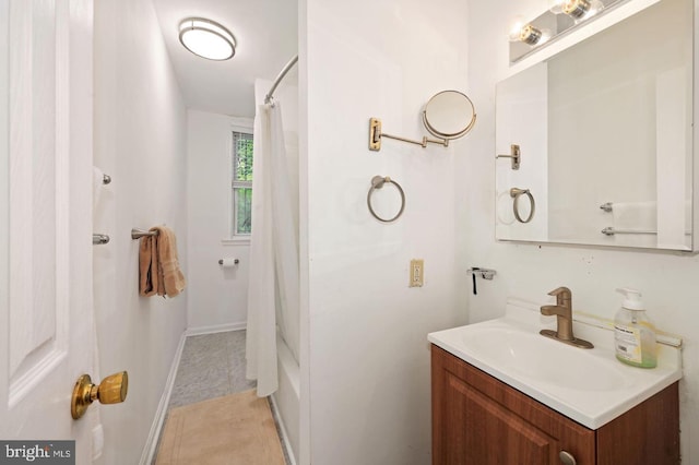 bathroom featuring tile patterned flooring and vanity