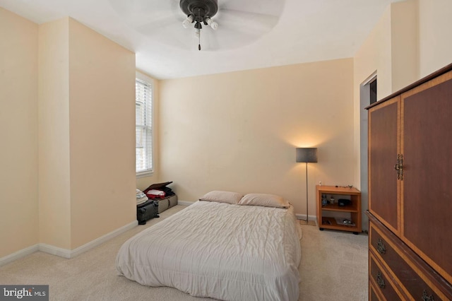 carpeted bedroom with a closet and ceiling fan