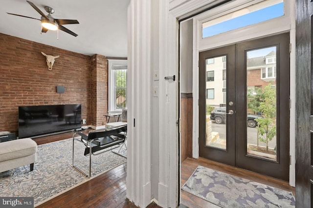 doorway with french doors, dark hardwood / wood-style flooring, and ceiling fan