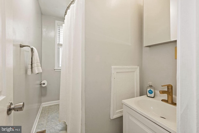 bathroom with tile patterned flooring and vanity