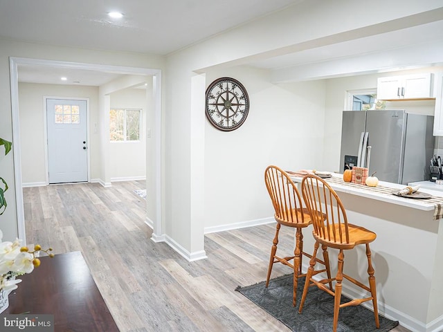 dining space featuring light wood-type flooring