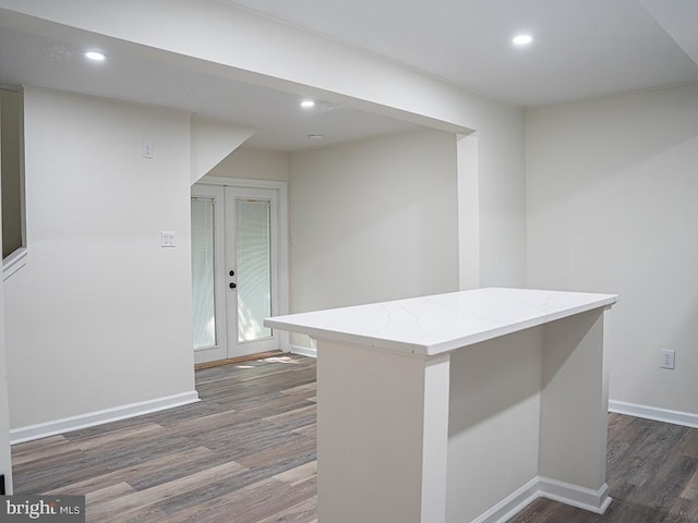 kitchen featuring french doors, a center island, and dark hardwood / wood-style floors