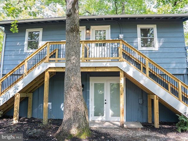 rear view of property featuring french doors